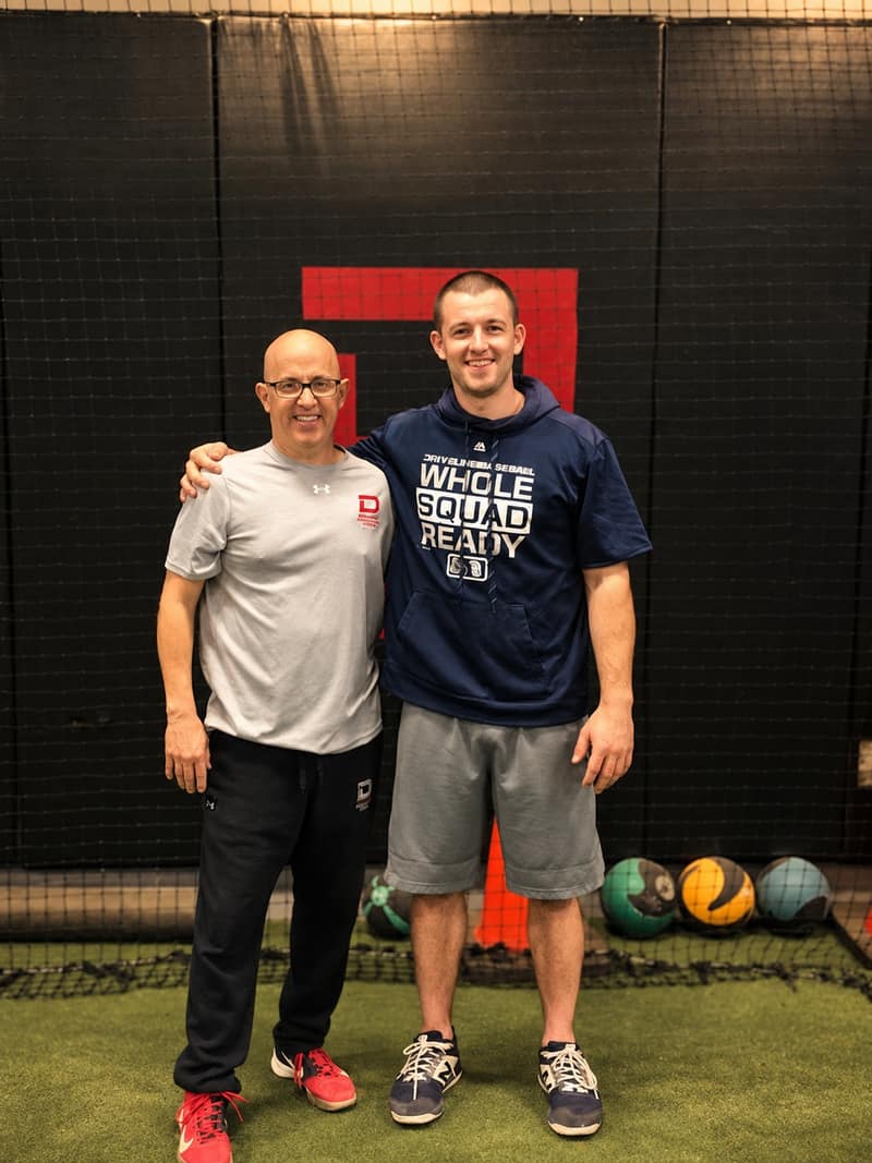 Lou DiChiaro with a former player at the academy
