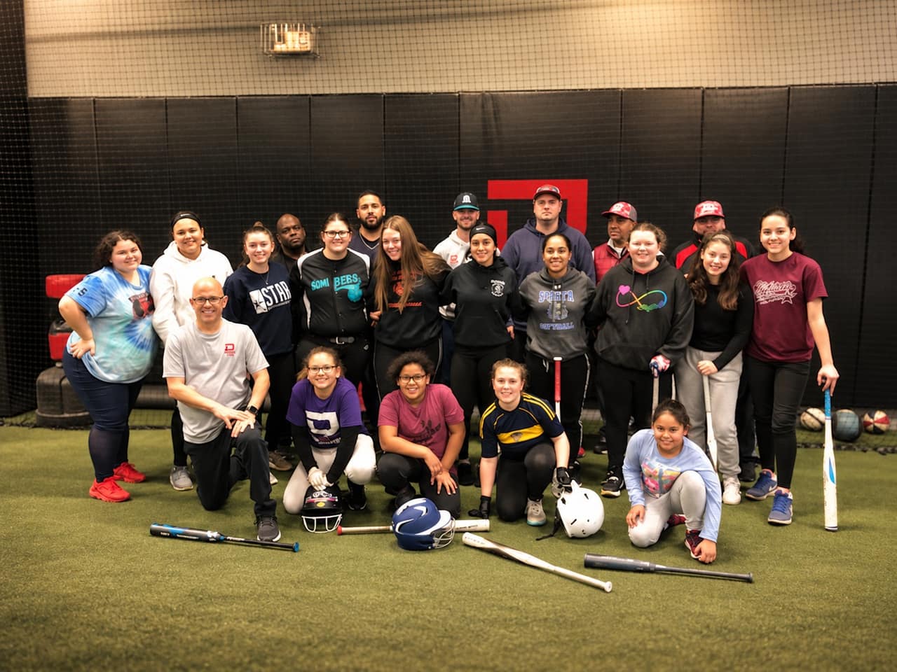 A softball clinic group with Lou and the coaches